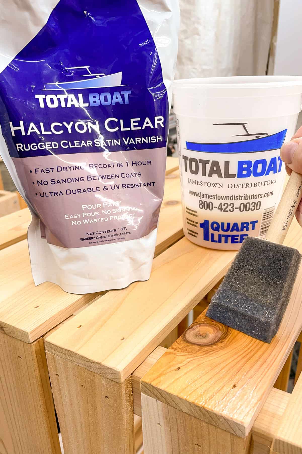 applying Total Boat Halcyon Clear varnish to completed planter box